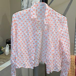 White button down shirt with neon orange polka dots